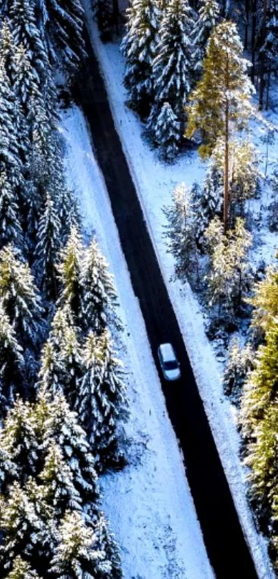 Aerial view of snowy forest road mobile wallpaper.