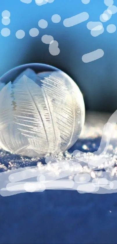 Frozen crystal globe on snow under clear blue sky.