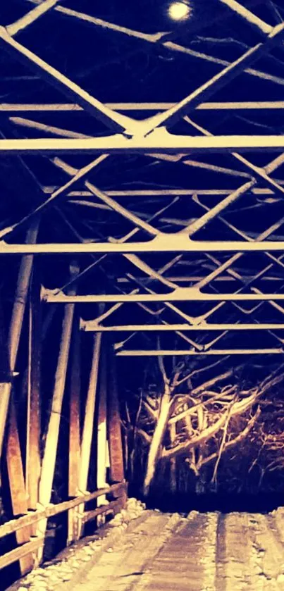 Snow-covered night bridge under a glowing sky.