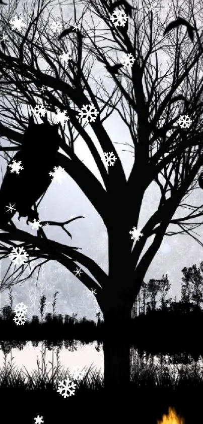 Silhouette tree with snowflakes under a gray sky.