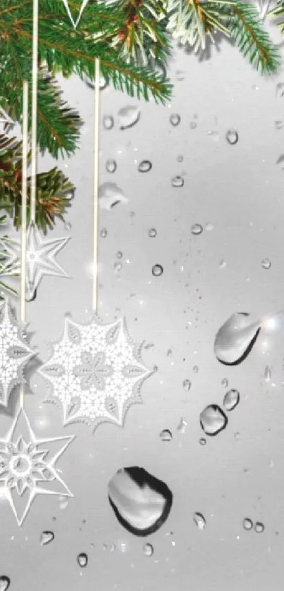 Rainy window with hanging snowflakes and evergreen leaves phone wallpaper.