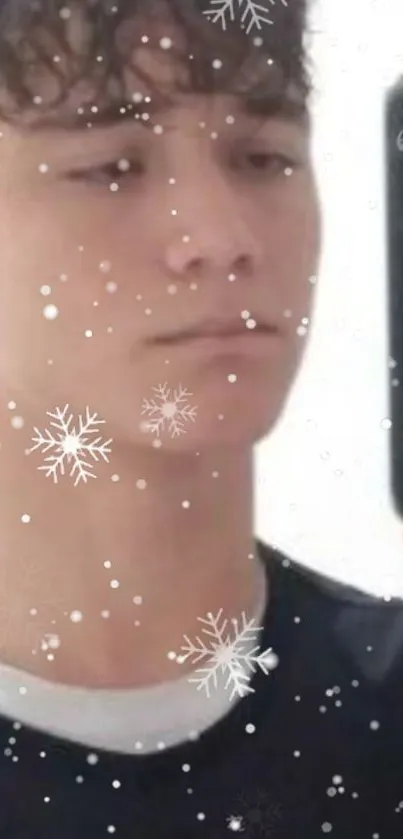 Selfie wallpaper with snowflakes overlay on a mobile background.