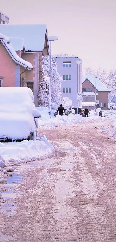 Snow-covered street with pastel houses and peaceful winter atmosphere.