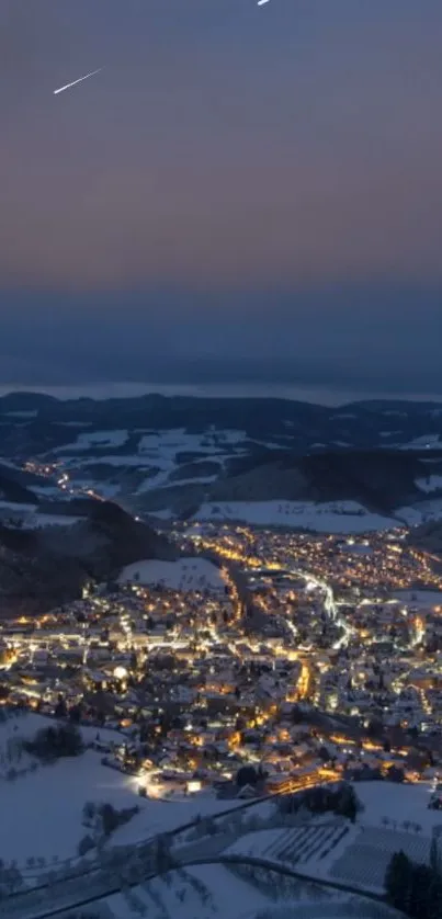 A snowy town brightly lit under a starry winter night sky.