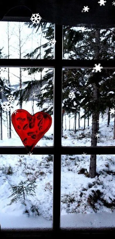 Winter landscape through a window with a red heart sticker.