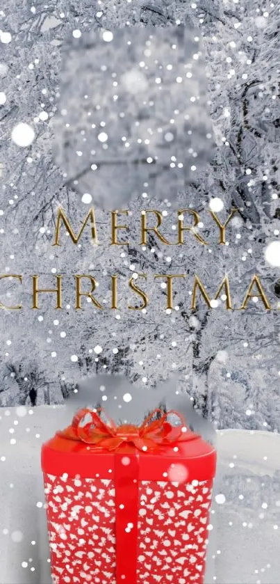 Snowy landscape with red Christmas gift box.