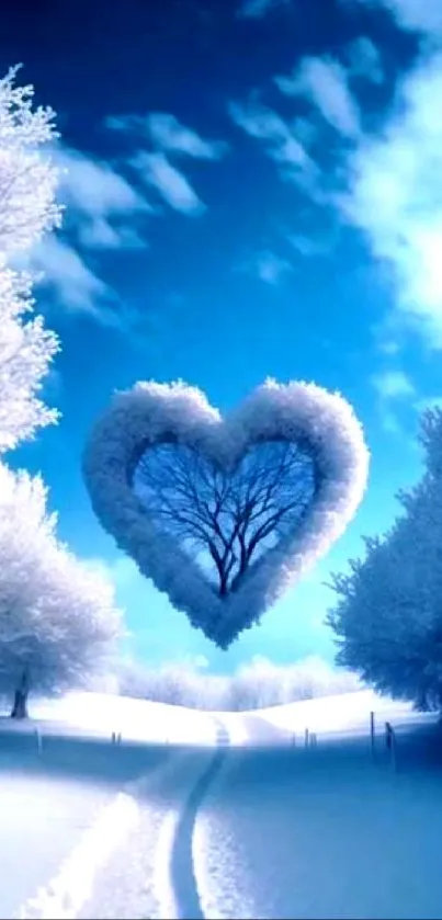 Heart-shaped tree in snowy landscape with blue sky wallpaper.
