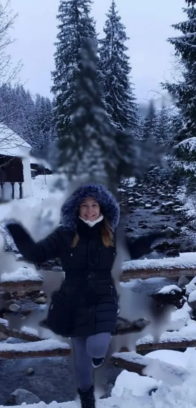 Woman enjoying winter scene with snowy trees and flowing river.