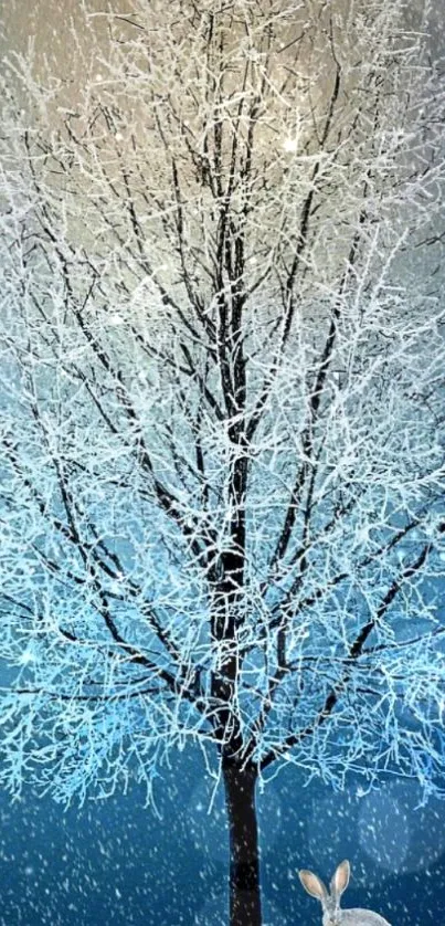 Winter tree with frosty branches in snowy blue setting.