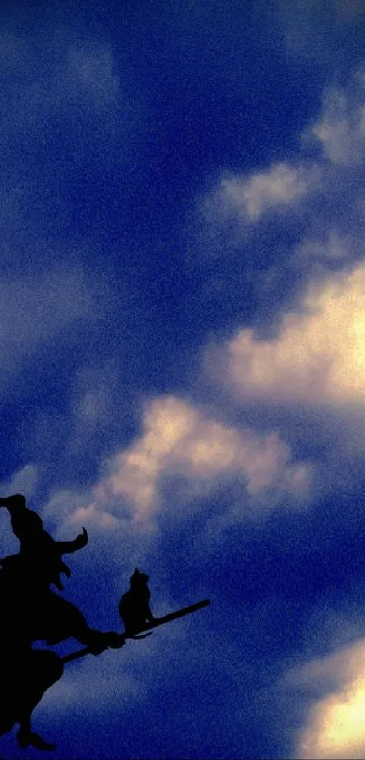 Silhouette of witch flying across a cloudy night sky.