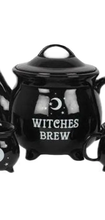 Black witches brew teapot with mystical moon design.