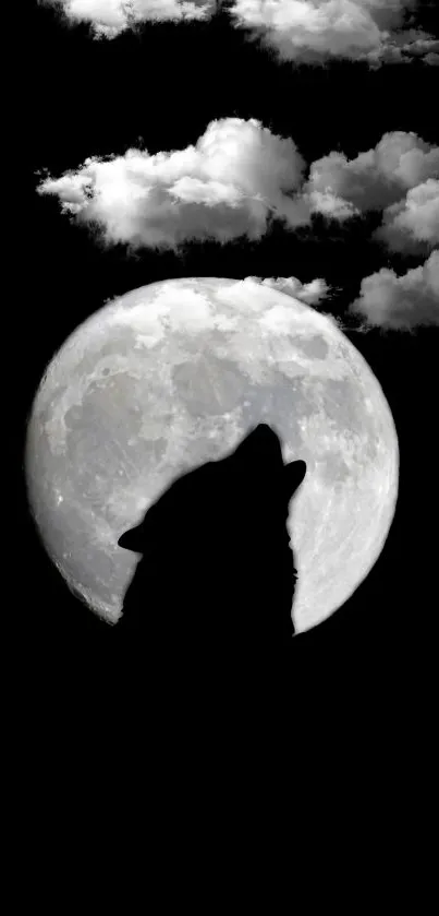 Silhouette of a wolf howling at the full moon with clouds in the night sky.