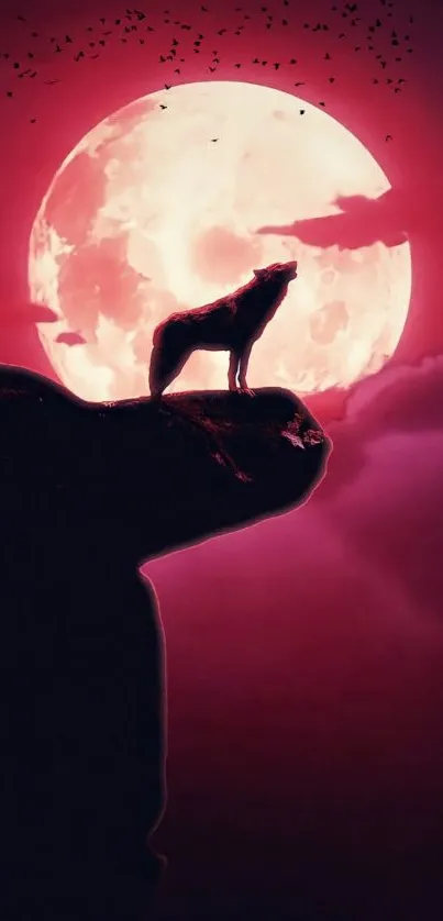 Wolf howling at the pink moon with a dramatic night sky.