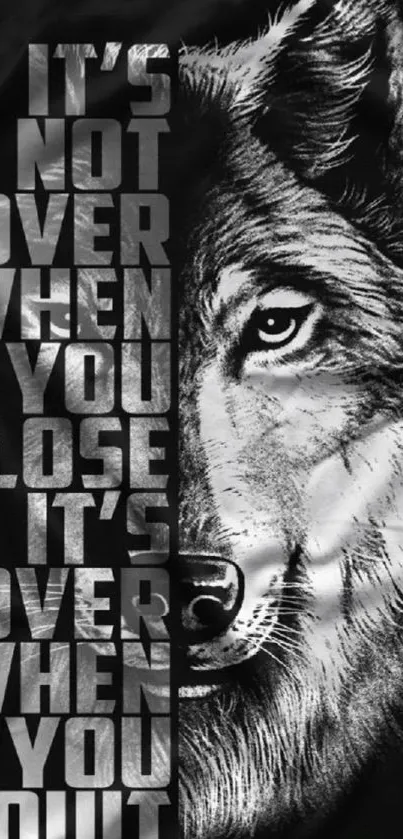 Motivational wolf wallpaper with inspiring quote in black and white.