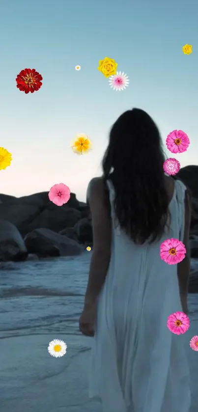 Woman in white dress walks by sea with colorful flowers in sky.