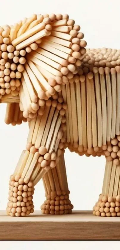 Intricate wooden matchstick elephant art sculpture for mobile wallpaper.