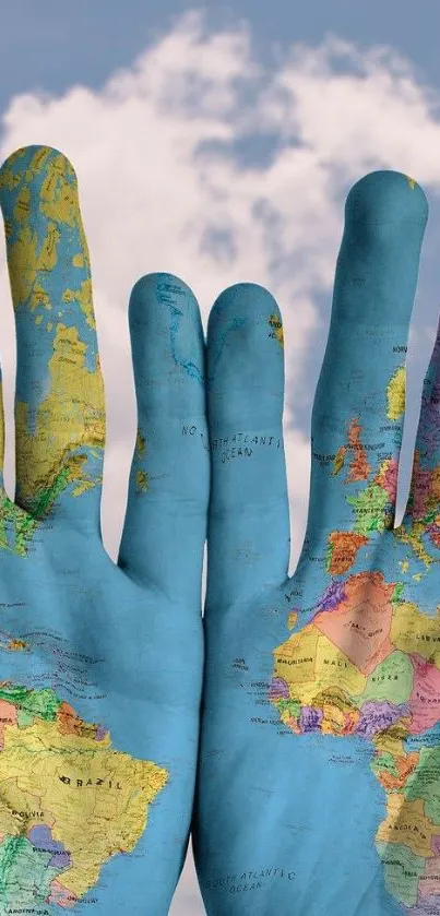 Hands painted with world map against a cloudy sky backdrop.