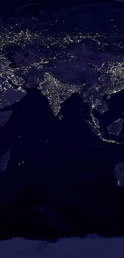 World map illuminated by city lights against a dark night sky.