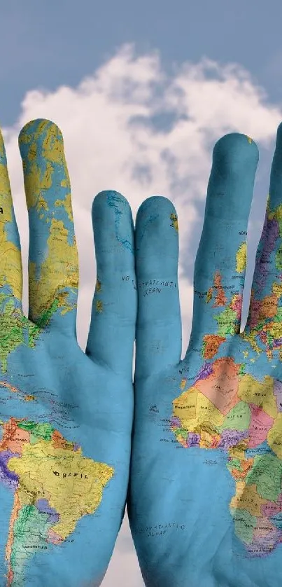 Hands painted with a world map against a cloudy sky.