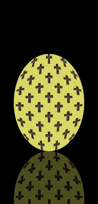 Yellow egg with cross pattern on black background wallpaper.