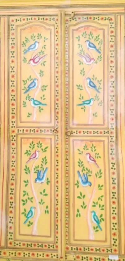 Hand-painted yellow wardrobe with birds and floral patterns.