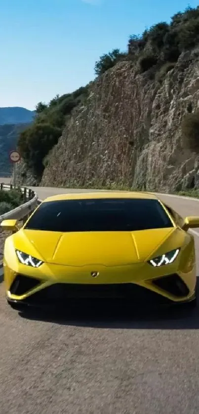 Yellow sports car racing on mountain road.