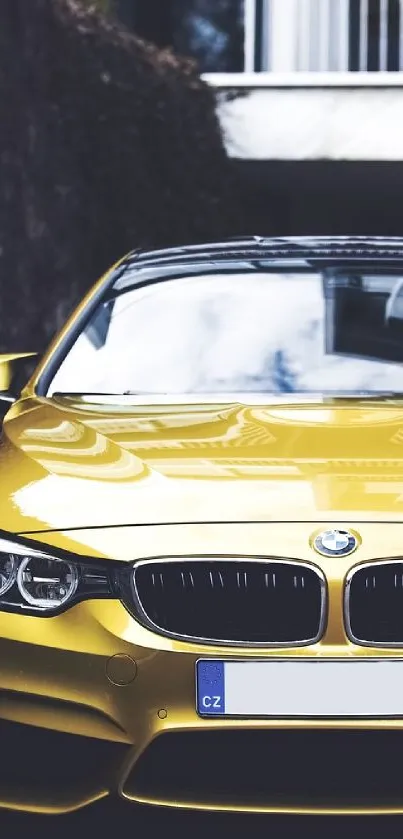 Yellow sports car parked in modern setting.