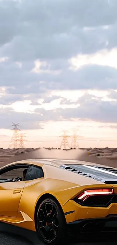 Yellow sports car on desert road with cloudy sky backdrop.