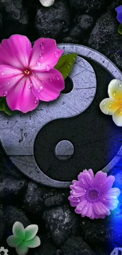 Yin Yang symbol with vibrant flowers and stones on a mobile wallpaper.