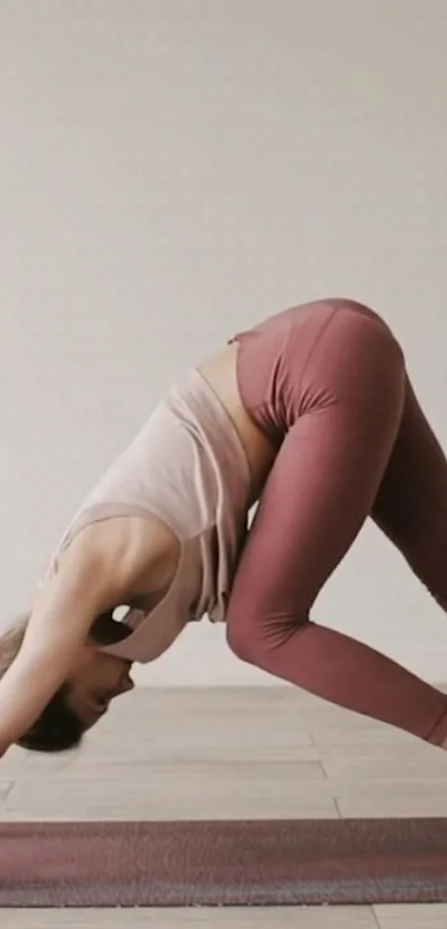 Woman performing yoga pose on mat, enhancing calmness.