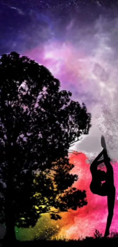 Silhouette of yoga pose with tree against a colorful galaxy background.