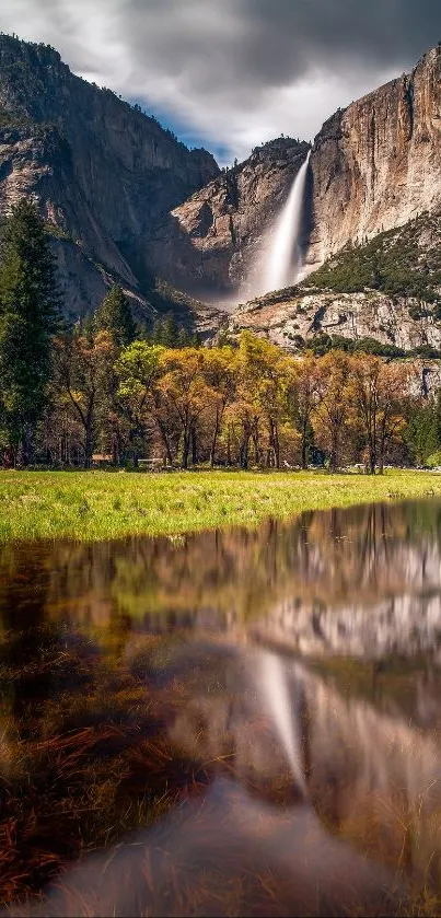 Breathtaking Yosemite waterfall reflected in serene waters with lush landscapes.