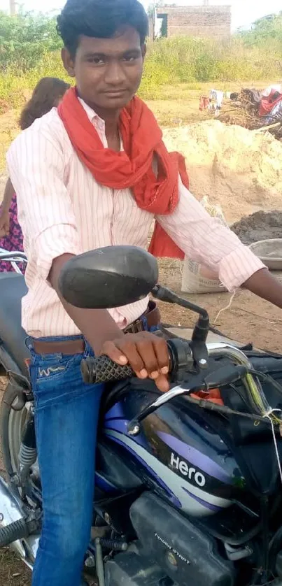 Young man sitting on a motorbike outdoors.