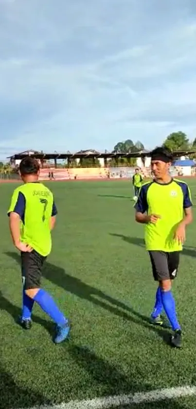 Young athletes playing soccer on a sunny field.