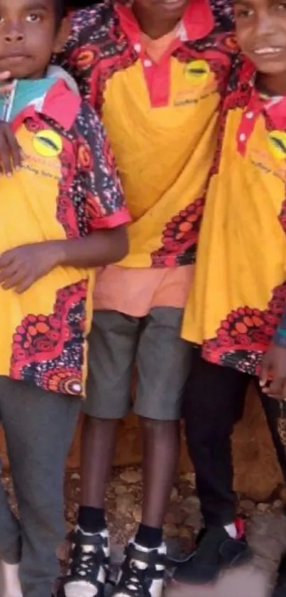 Three kids wearing vibrant, colorful clothing in a group setting.