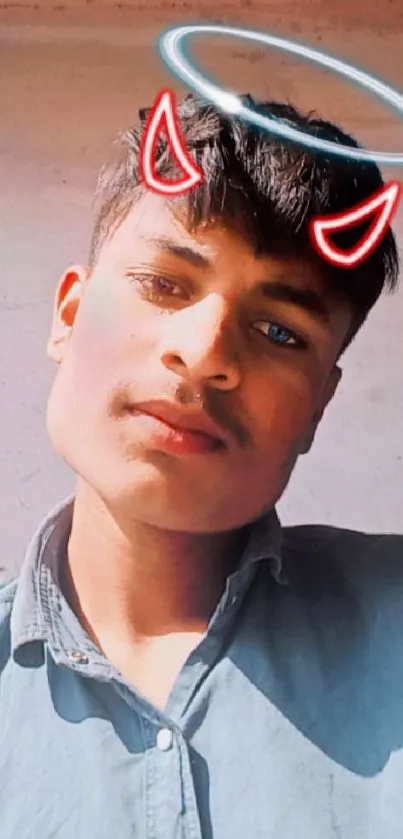 Portrait of young person with halo and horns on mobile wallpaper.