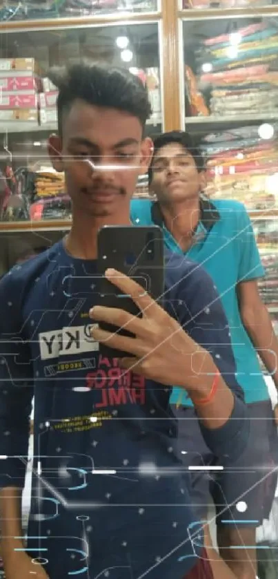 Two young friends taking a mirror selfie in a clothing shop with vibrant backgrounds.