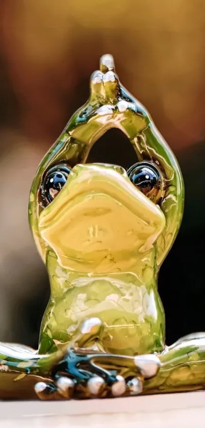 Green ceramic frog in yoga pose mobile wallpaper.