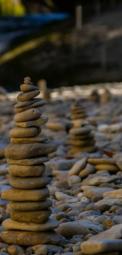 Stack of smooth pebbles on a rocky beach, creating a tranquil scene.