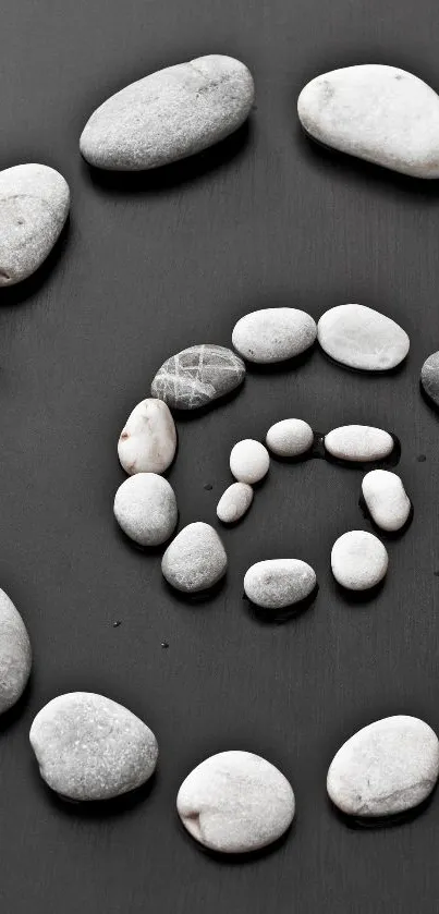 Spiral of white stones on a black background, creating a calm and minimalist look.