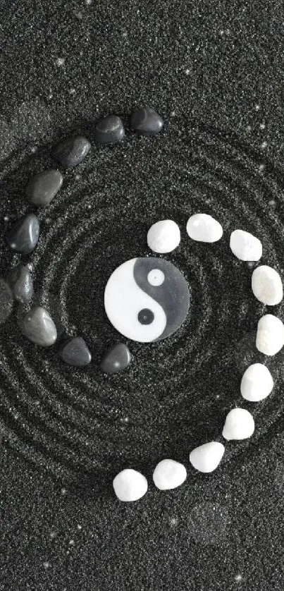 Yin yang stones on black background creating a serene, Zen-inspired mobile wallpaper.