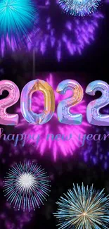 Colorful fireworks and '2022' text New Year wallpaper.