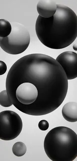 3D black and gray spheres floating on a gray background.