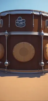 3D drum set on sandy, sunny background.