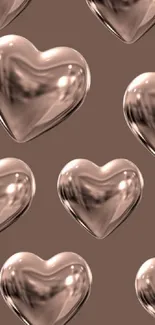 3D glass hearts on a brown background.