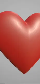 3D red heart with a smooth finish on a minimalist gray background.