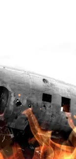 Abandoned plane wreck on a desolate black sand beach in grayscale.