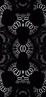 Intricate black and white geometric pattern wallpaper.