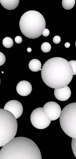 Abstract black background with floating white spheres.