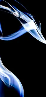 Abstract blue smoke on a black background creating an ethereal and mysterious look.